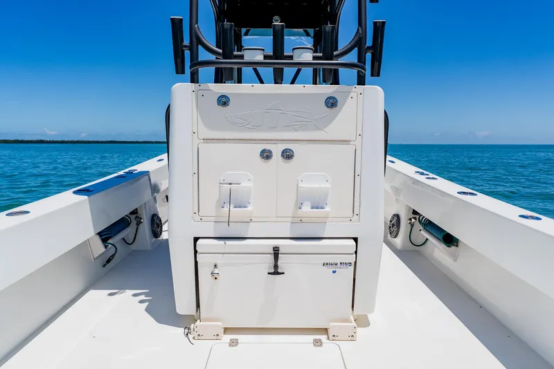 Slide: The Image of 2016 Andros 32 Offshore boat interior with storage compartments, set against a clear blue ocean backdrop. - 61