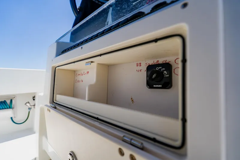 Slide: The Image of Control panel on a 2016 Andros 32 Offshore boat, featuring a Suzuki switch. - 56