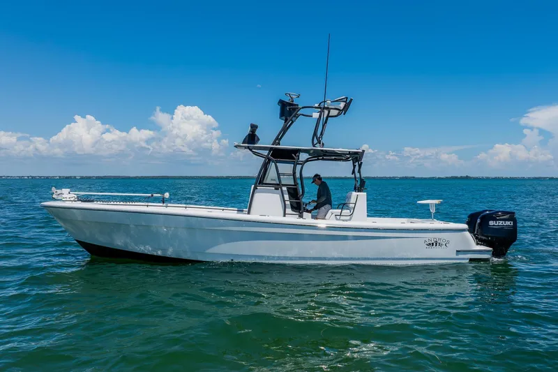Slide: The Image of 2016 Andros 32 Offshore boat on calm ocean waters under clear blue sky. - 6