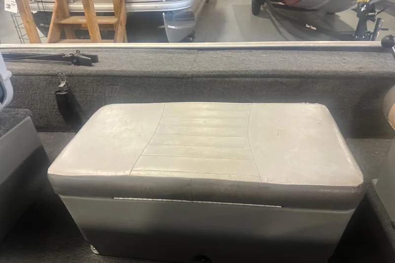 Slide: The Image of 2015 Tracker Panfish 16 boat interior with cushioned seat and storage compartment. - 8