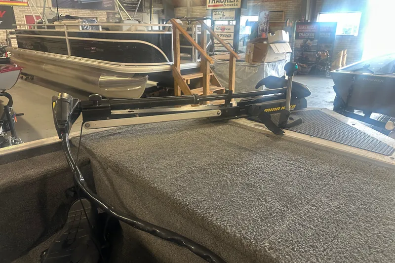 Slide: The Image of 2015 Tracker Panfish 16 boat with trolling motor in showroom setting. - 6