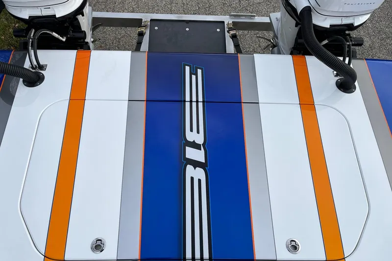 Slide: The Image of 2023 Skater 318 boat with vibrant blue, orange, and gray design accents. - 9