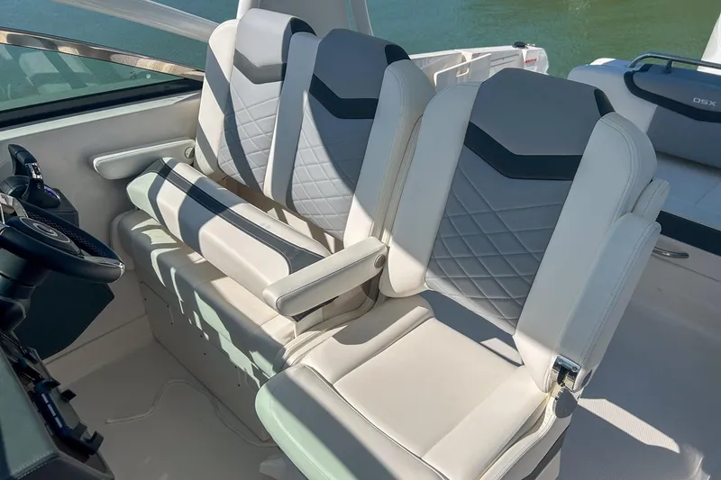 Slide: The Image of 2024 Chaparral 280 OSX boat interior with luxurious seating and modern design. - 15