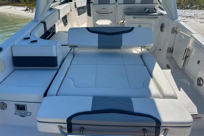 Slide: The Image of 2024 Chaparral 280 OSX boat interior with luxurious seating and modern design. - 13