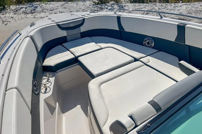 Slide: The Image of 2024 Chaparral 280 OSX boat interior with spacious seating and cup holders. - 5