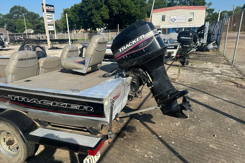 Slide: The Image of 1999 Tracker Pro Team 185 boat with outboard motor on a trailer. - 7