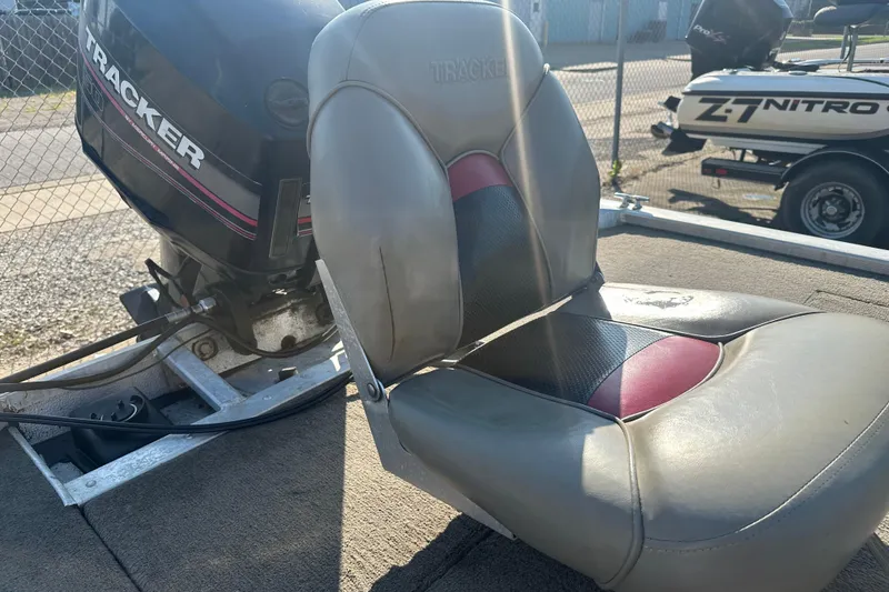 Slide: The Image of 1999 Tracker Pro Team 185 boat seat and motor in sunlight. - 10