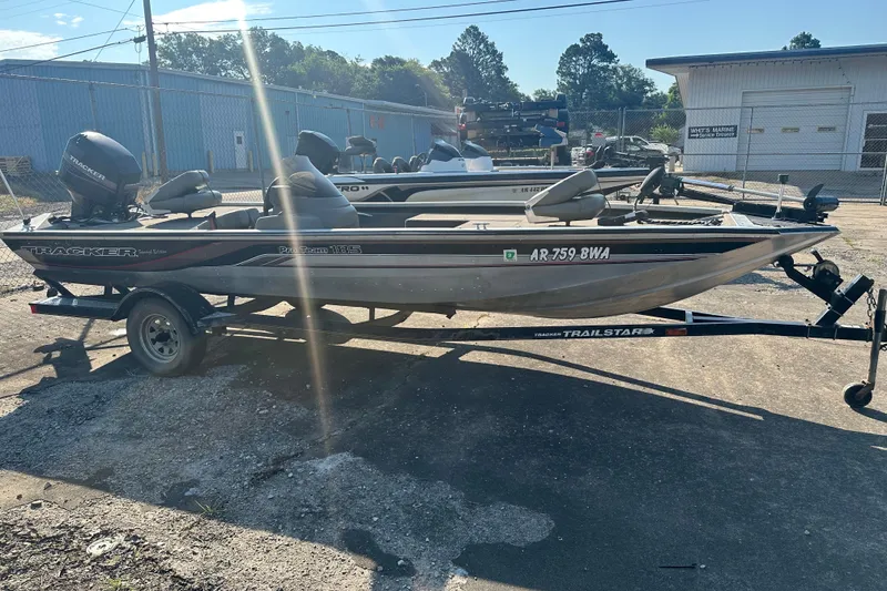 Slide: The Image of 1999 Tracker Pro Team 185 boat on trailer in outdoor setting. - 2