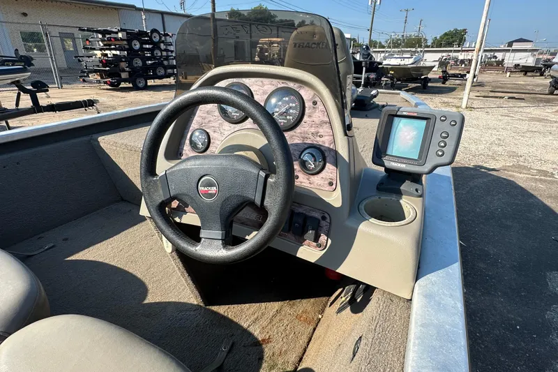 Slide: The Image of 1999 Tracker Pro Team 185 boat dashboard with steering wheel and fish finder. - 20
