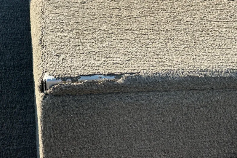 Slide: The Image of Worn carpeted corner on 1999 Tracker Pro Team 185 boat. - 18