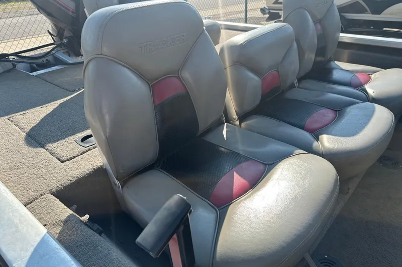 Slide: The Image of 1999 Tracker Pro Team 185 boat interior with gray and red seating. - 11