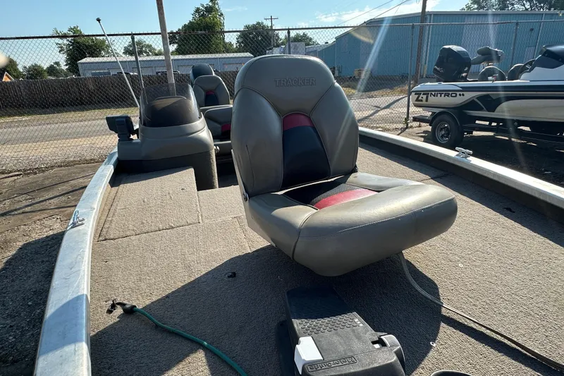 Slide: The Image of 1999 Tracker Pro Team 185 boat interior with seating and control panel. - 19