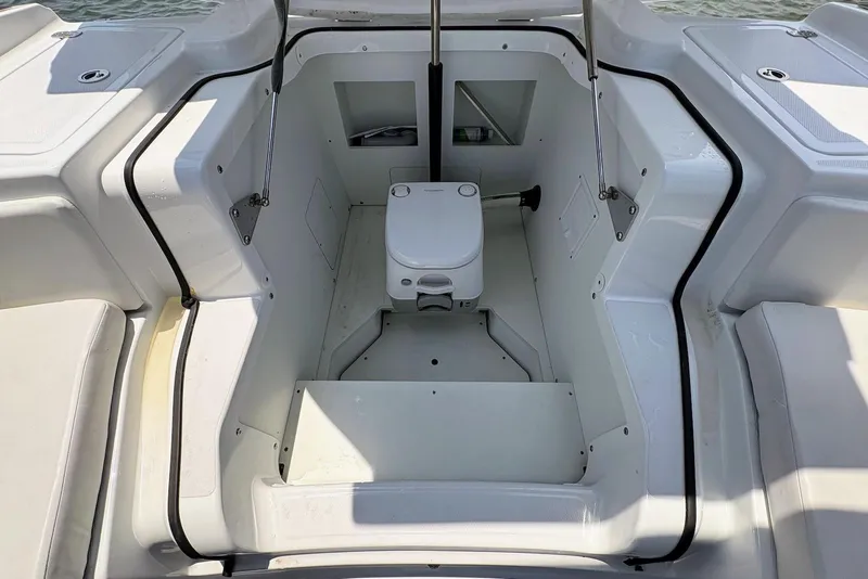 Slide: The Image of 2022 Four Winns H4 OB boat interior with seating and storage compartments. - 19