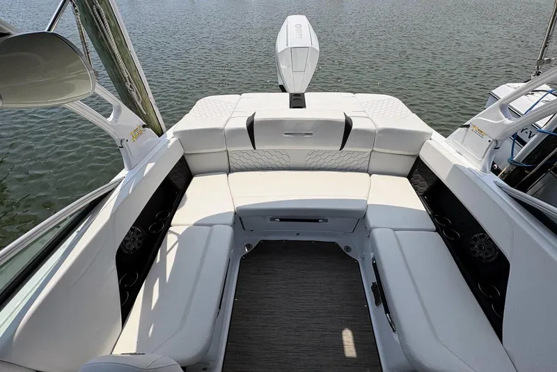 Slide: The Image of 2022 Four Winns H4 OB boat interior with white seating and water view. - 11