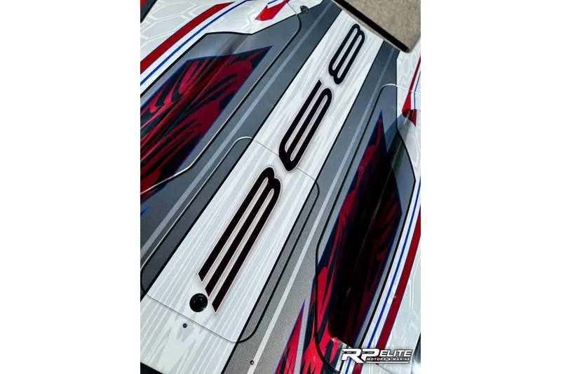 Slide: The Image of 2024 Skater 368 boat with sleek design and vibrant red, blue, and white graphics. - 32