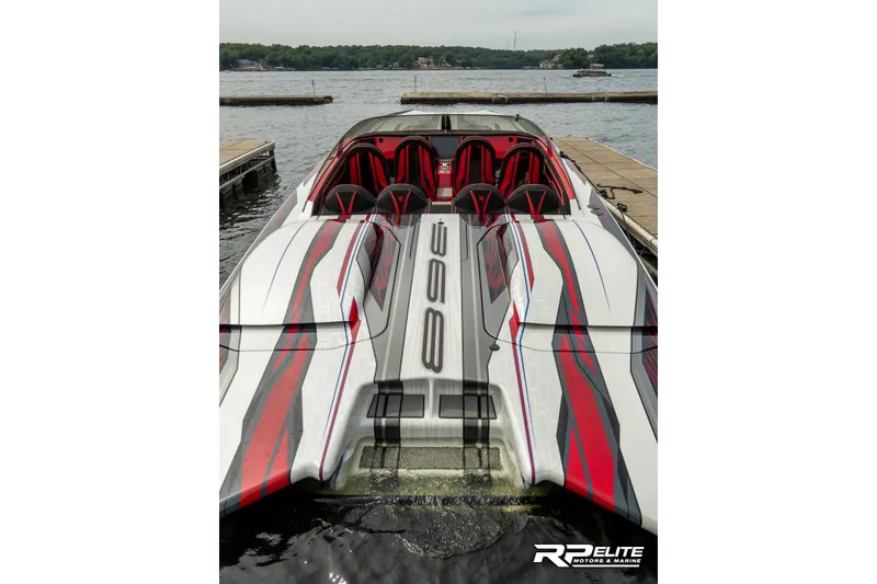 Slide: The Image of 2024 Skater 368 powerboat with sleek design docked on a lake. - 28