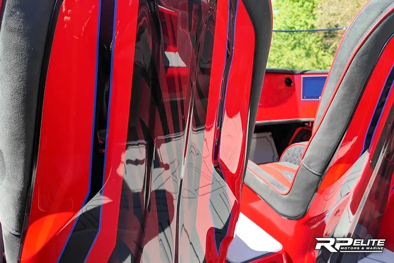 Slide: The Image of Red and black interior of 2024 Skater 368 boat, featuring sleek design and modern seating. - 24