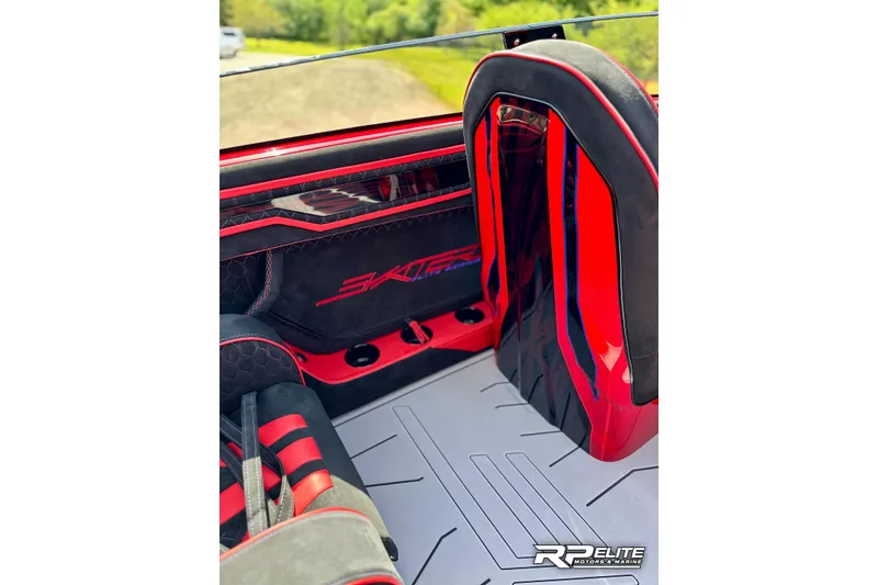 Slide: The Image of Interior of 2024 Skater 368 boat with red and black accents, featuring sleek design elements. - 23