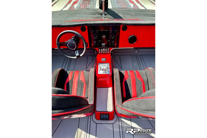 Slide: The Image of Luxurious 2024 Skater 368 boat interior with red and black accents, sleek dashboard, and modern controls. - 14
