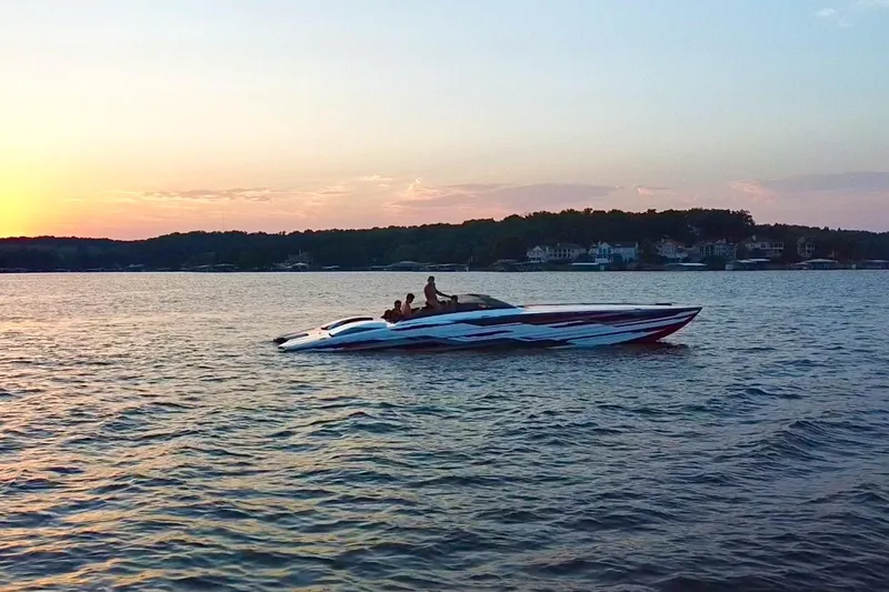 Slide: The Image of 2024 Skater 368 speedboat cruising on a lake at sunset. - 54