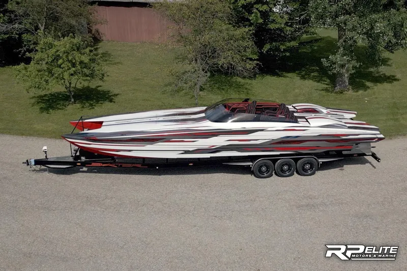 Slide: The Image of 2024 Skater 368 speedboat on trailer, featuring sleek red and white design. - 48