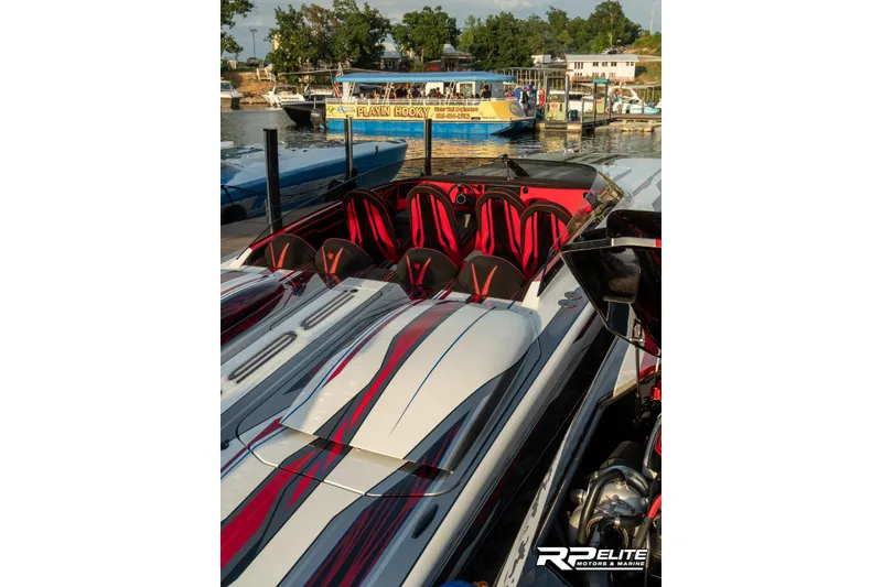 Slide: The Image of 2024 Skater 368 speedboat with sleek design docked at a marina. - 26