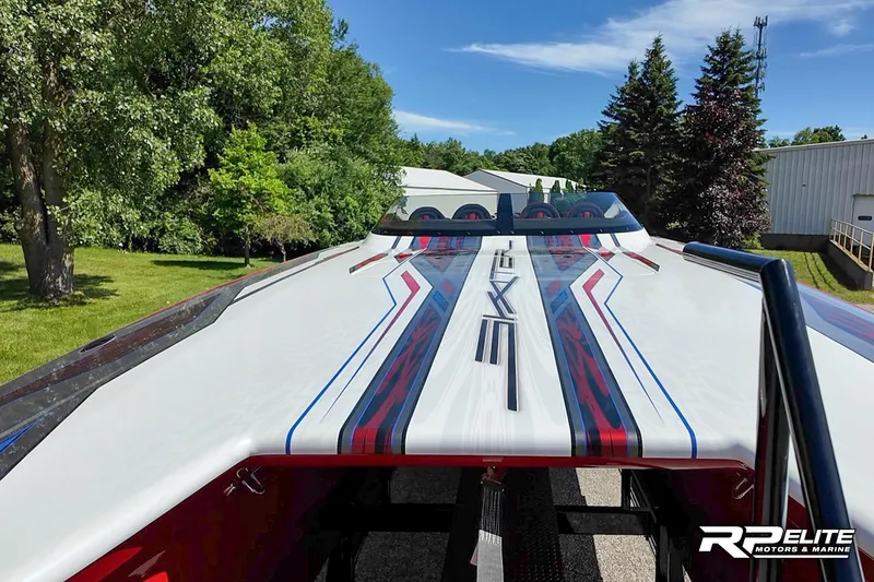 Slide: The Image of 2024 Skater 368 boat with sleek design and vibrant graphics, showcased outdoors. - 10
