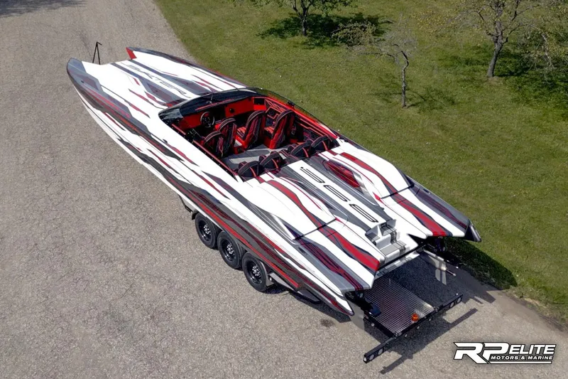 Slide: The Image of 2024 Skater 368 powerboat with sleek red, white, and black design on a trailer. - 39