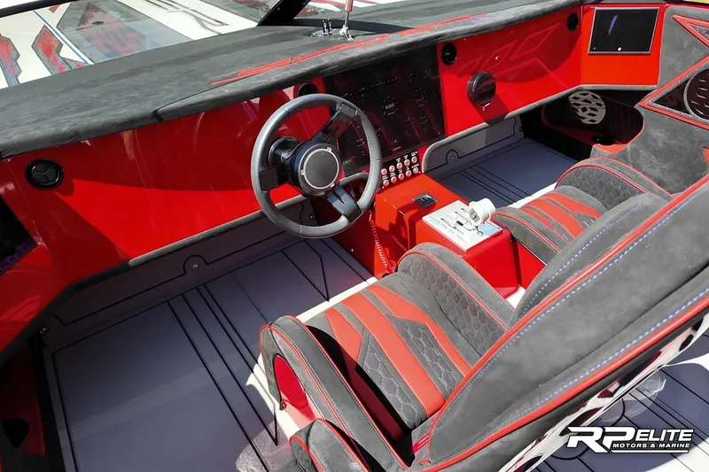 Slide: The Image of Luxurious 2024 Skater 368 boat interior with red and black accents, advanced controls, and sleek design. - 12