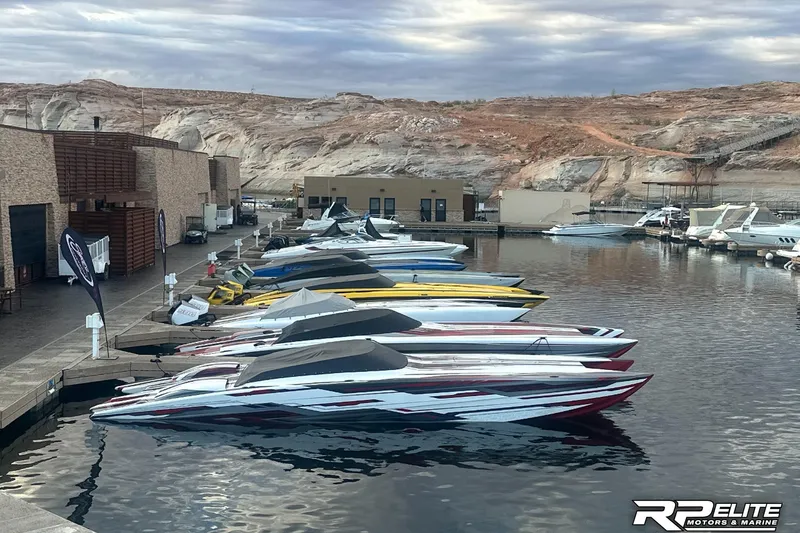 Slide: The Image of Boats docked at a marina with rocky landscape, featuring 2024 Skater 368 models. - 53