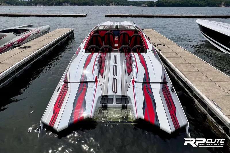 Slide: The Image of High-performance 2024 Skater 368 boat docked, featuring sleek red and white design. - 49