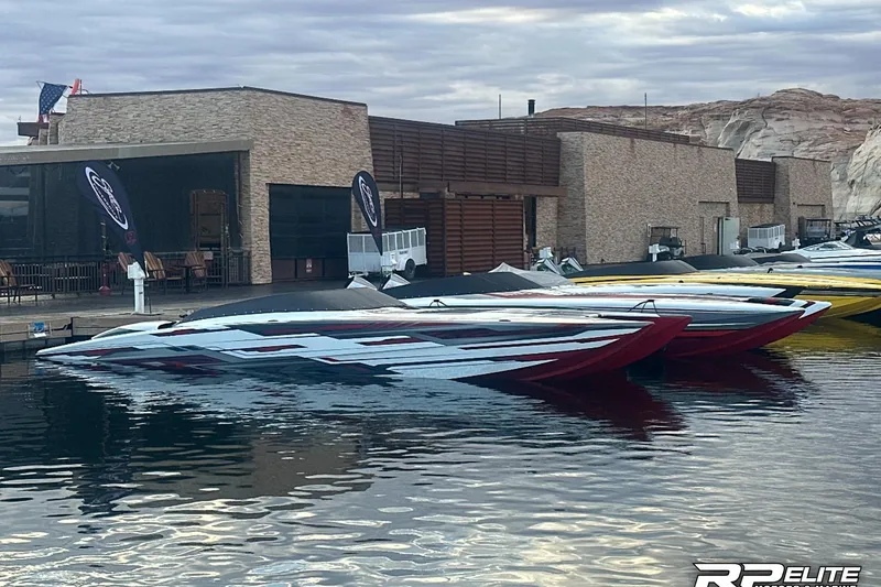 Slide: The Image of 2024 Skater 368 powerboats docked at a marina, showcasing sleek design and vibrant colors. - 52