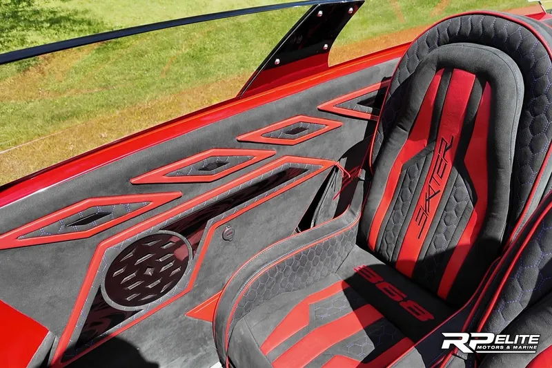 Slide: The Image of Red and black interior of 2024 Skater 368 boat, featuring sleek design and branding. - 18