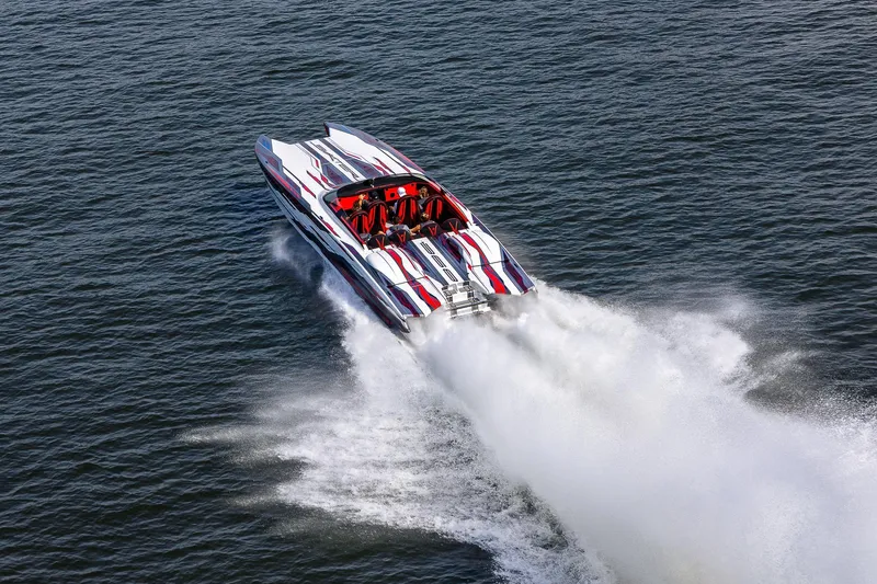 Slide: The Image of High-speed 2024 Skater 368 powerboat racing on open water, creating a dramatic wake. - 6