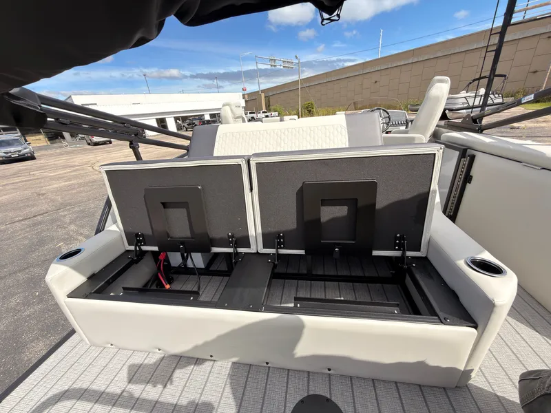 Slide: The Image of The image shows the interior of a 2027 Sylvan Q-22 ULZ with foldable seats. - 48