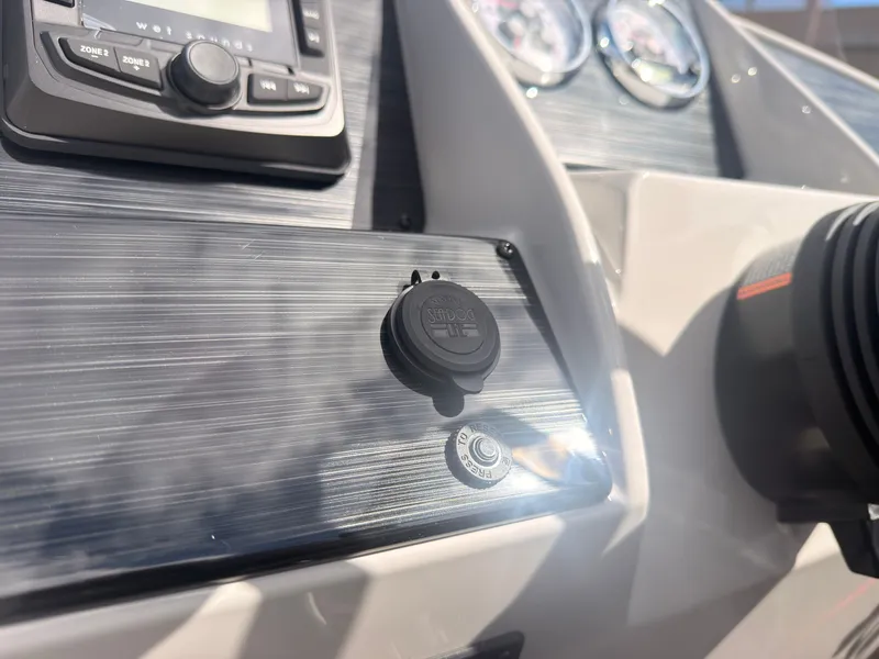 Slide: The Image of Close-up of a Sylvan Q-22 ULZ boat dashboard with instruments and controls. - 36