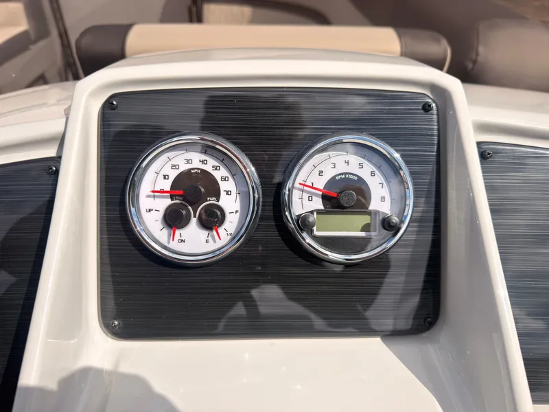 Slide: The Image of The image shows the dashboard of a Sylvan Q-22 ULZ with two analog gauges. - 33