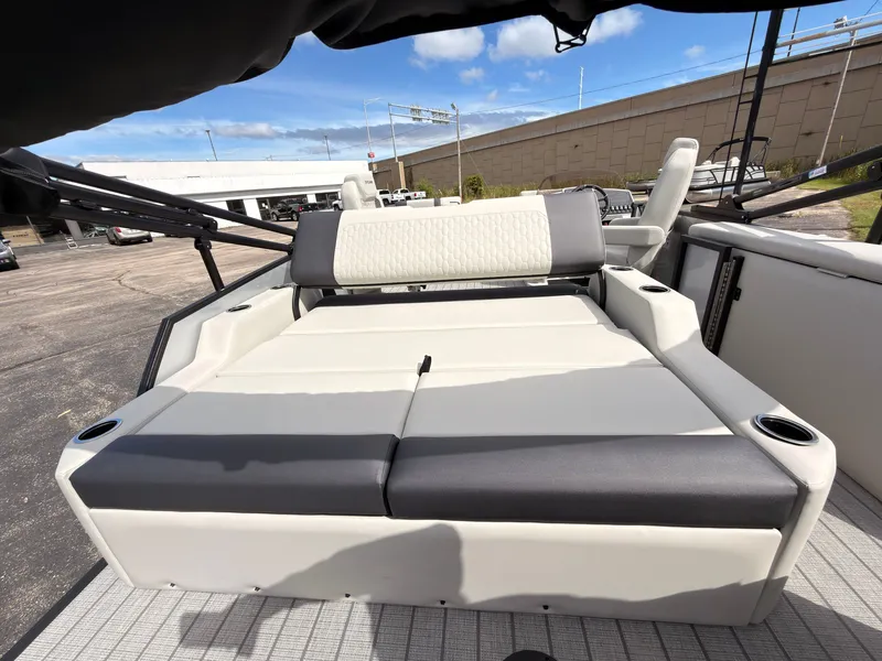 Slide: The Image of The image shows the lounge seating of a 2027 Sylvan Q-22 ULZ with gray and white upholstery. - 47