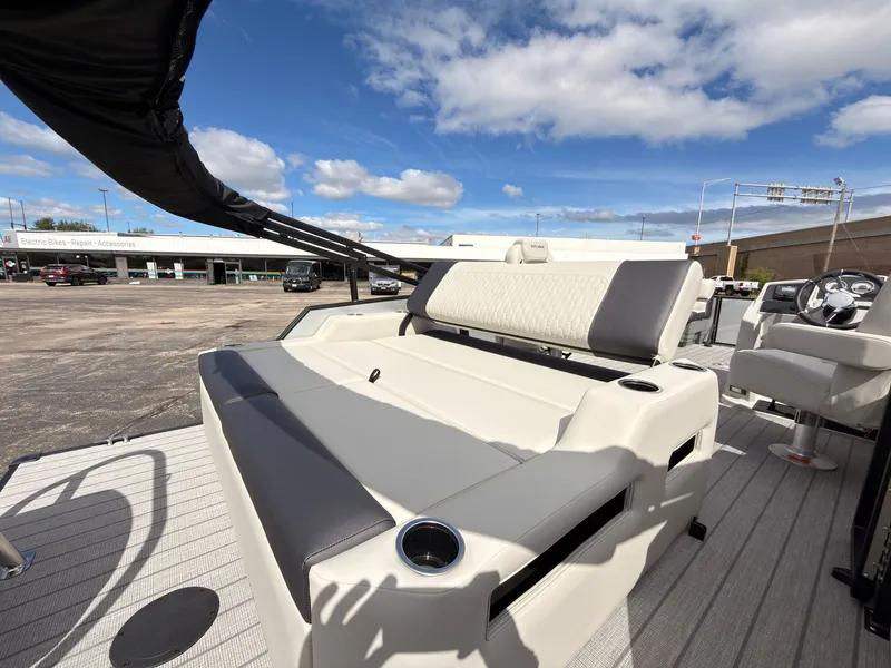 Slide: The Image of The image shows the deck of a 2027 Sylvan Q-22 ULZ boat with comfortable seating. - 46