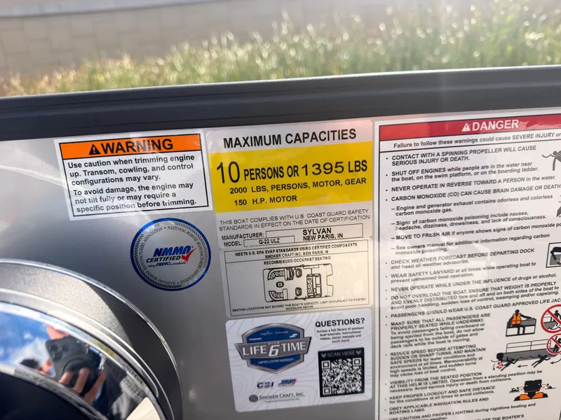 Slide: The Image of Label on a 2027 Sylvan Q-22 ULZ boat shows capacity: 10 persons or 1395 lbs. - 38