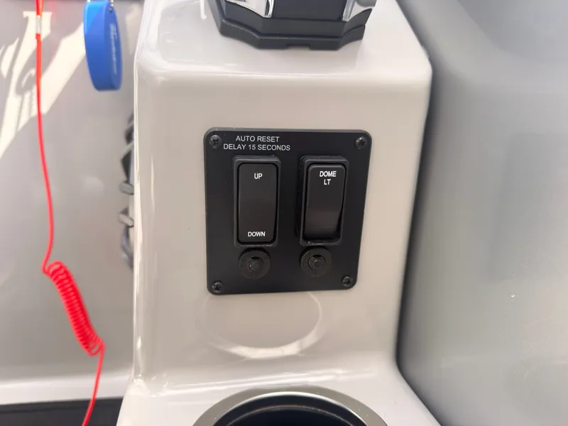 Slide: The Image of Close-up of a control panel with switches for "Up," "Down," and "Dome Lt." A cup holder is visible. - 39