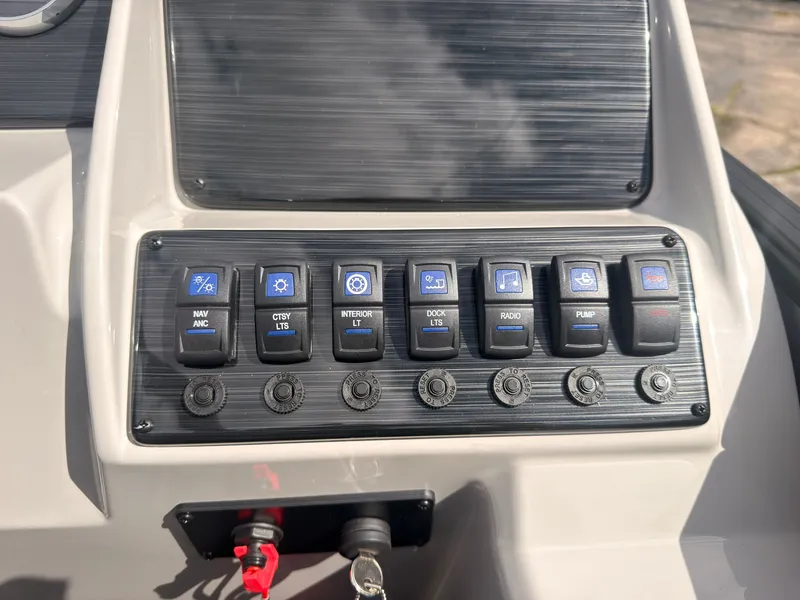 Slide: The Image of The image shows a modern boat control panel with various switches and buttons. - 34