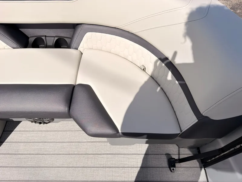 Slide: The Image of The 2027 Sylvan Q-22 ULZ features a sleek, upholstered seating area with modern accents. - 18