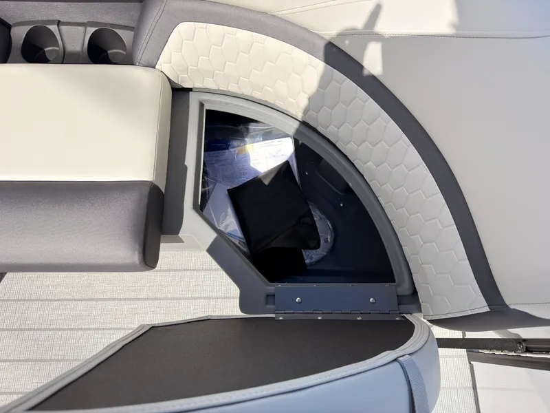 Slide: The Image of A seating area with storage underneath, containing documents and a black pouch. - 19