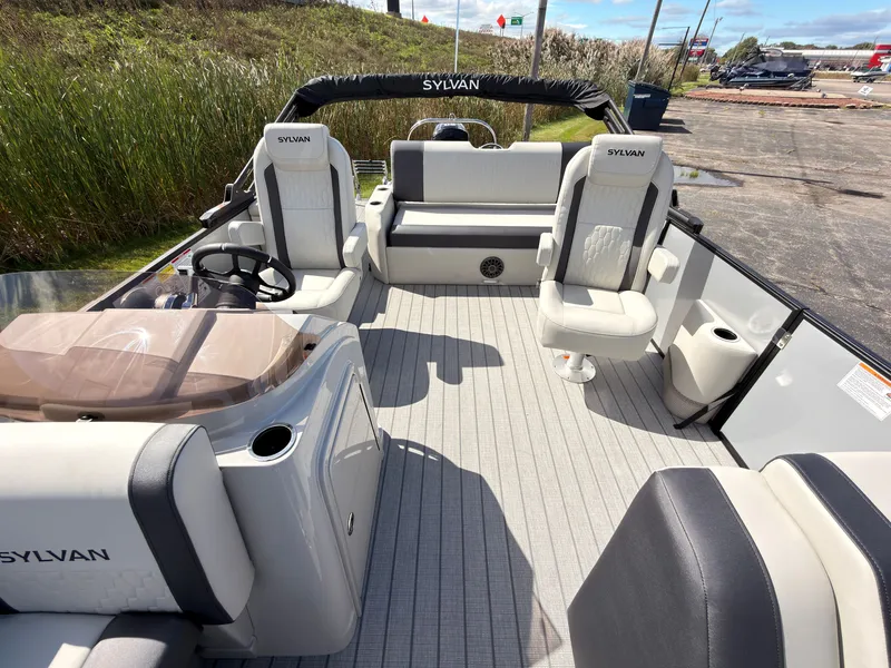Slide: The Image of The image shows the spacious deck of a 2027 Sylvan Q-22 ULZ with comfortable seating. - 22