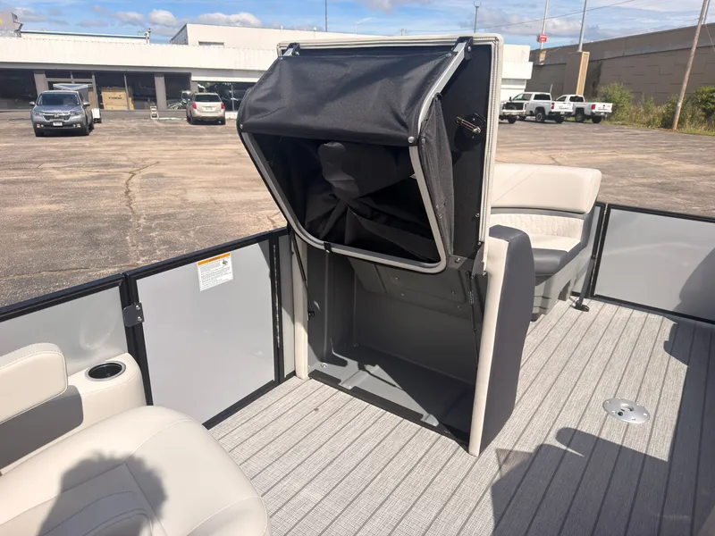 Slide: The Image of The image shows the deck of a 2027 Sylvan Q-22 ULZ with seating and a storage compartment. - 25
