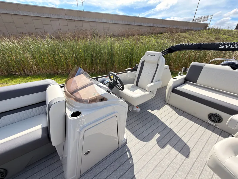 Slide: The Image of The image shows the cockpit of a 2027 Sylvan Q-22 ULZ with comfortable seating and a modern helm. - 28