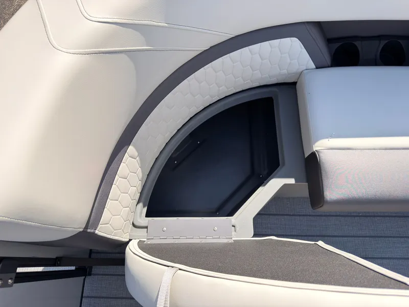 Slide: The Image of The image shows a sleek, upholstered seat with a textured design and a storage compartment underneath. - 13