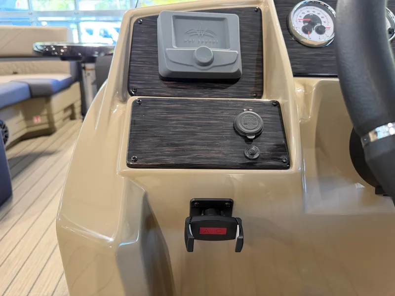 Slide: The Image of The image shows the dashboard of a Sylvan Q-22 ULZ boat with modern controls. - 18