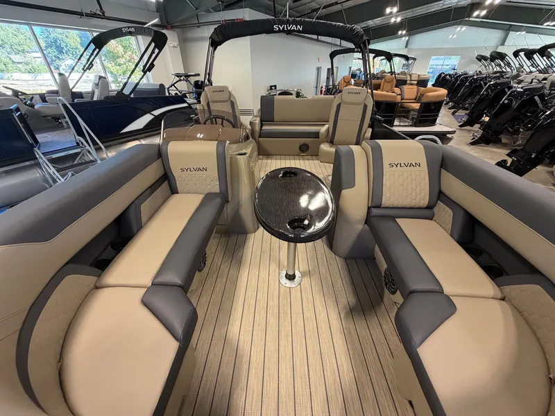 Slide: The Image of The image shows the interior of a 2027 Sylvan Q-22 ULZ boat with sleek seating. - 4